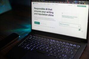Laptop displaying an AI writing assistant on screen, representing SEO and AI tools